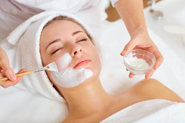 Woman in mask on face in beauty salon.